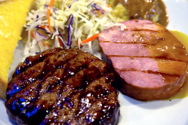 istock Teriyaki Pork, Ham Steak and Mashed Potatoes on white plate 1086842970