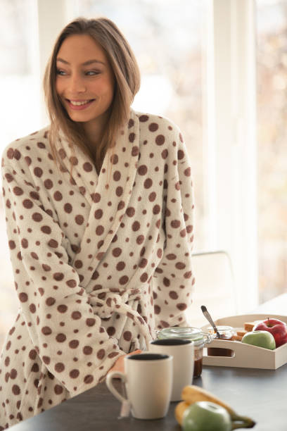 istock Beautiful woman in bathrobe enjoying a slow morning 1086845220