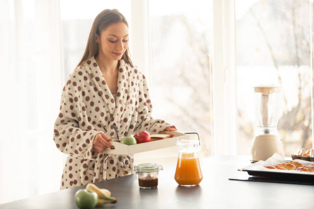 istock Woman carrying breakfast to bed 1086845248