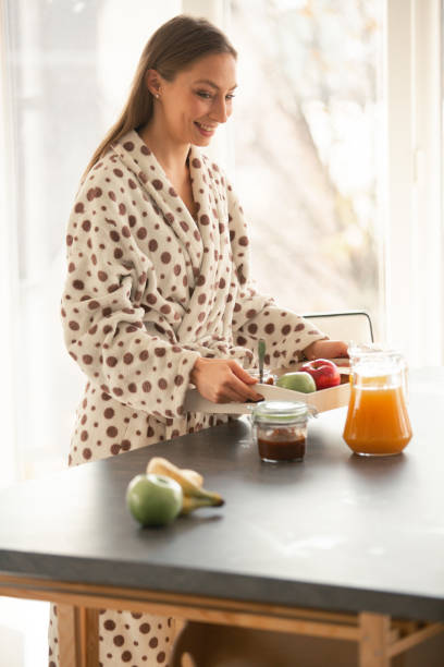 istock Woman carrying breakfast to bed 1086845258