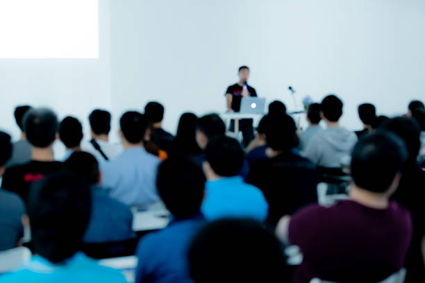 istock Blur of people in conference room. 1086845448