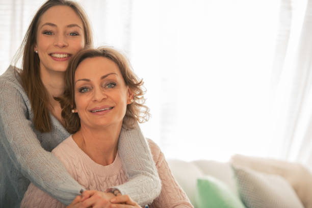 istock Happy mother and daughter hugging 1086845820
