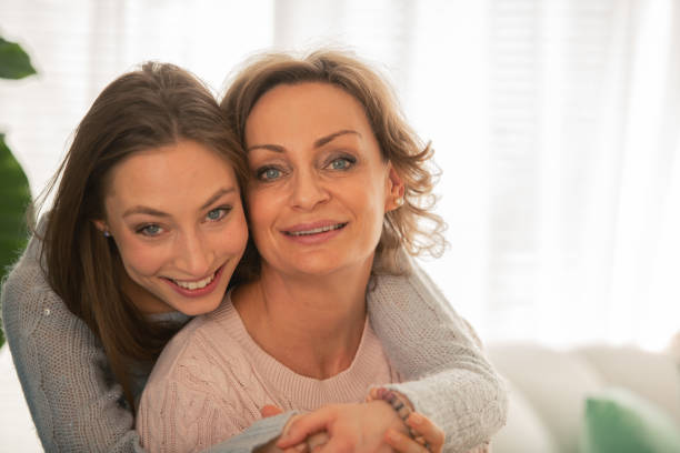 istock Happy mother and daughter hugging 1086845822