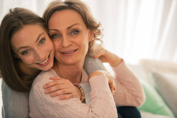 istock Happy mother and daughter hugging 1086845832