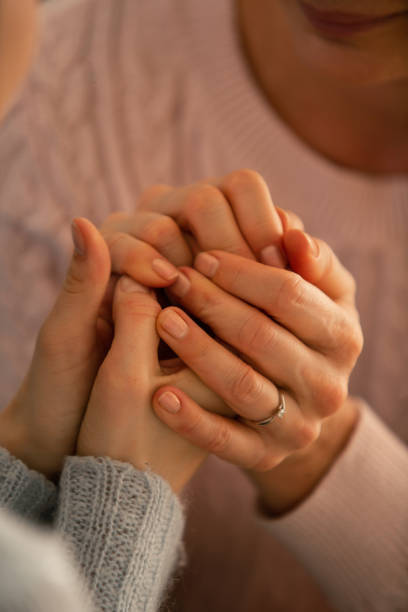 istock Mother and daughter holding hands 1086845864