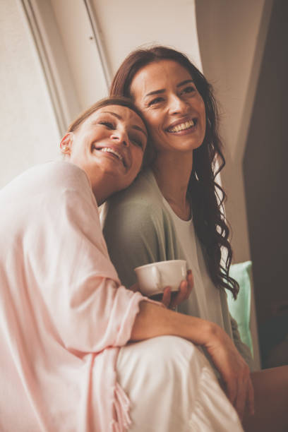 istock Woman leaning on friend's shoulder 1086847352