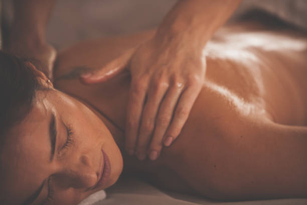 istock Woman enjoying shoulder massage at spa 1086849426