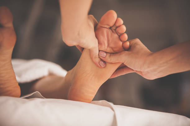 istock Woman having a relaxing foot massage at spa 1086849582