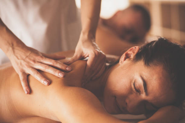 istock Woman enjoying shoulder massage at spa 1086849752