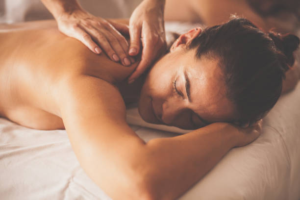 istock Woman enjoying shoulder massage at spa 1086849766