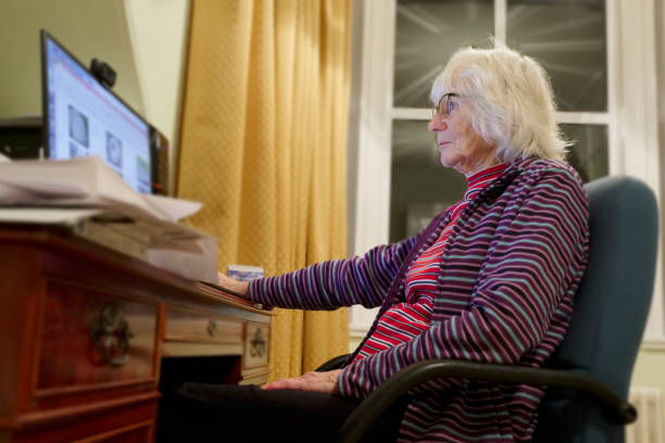 istock Old elderly senior person learning computer and online internet skills protect money scam and fraud 1086849930