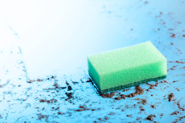 istock Sponge on a dirty glass. 1086850198