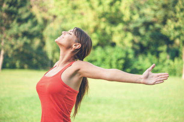 istock Young woman raising her arms 1086852320