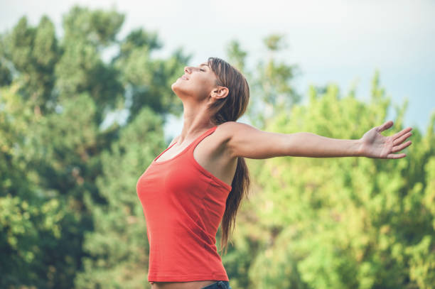 istock Young woman raising her arms 1086852350