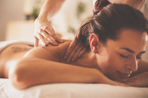 istock Relaxed woman enjoying back and shoulder massage at spa 1086852556