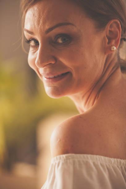 istock Mature woman looking over shoulder 1086854294