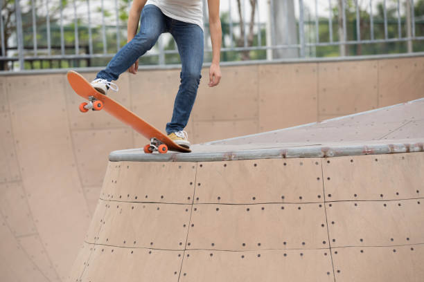 istock skater legs skating on ramp at skatepark 1086854898