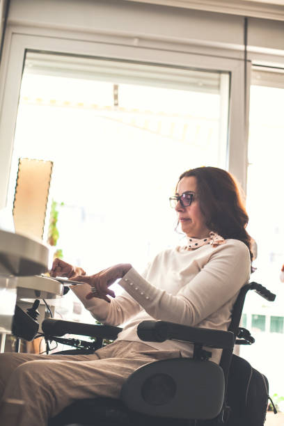 istock Woman with disability working in home office 1086856676