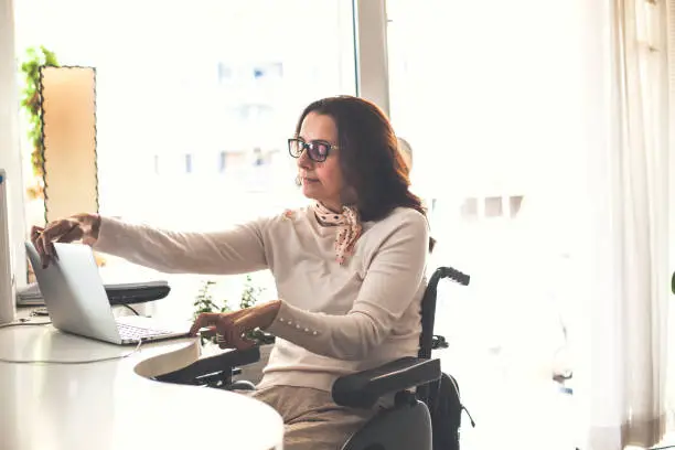 Photo of Woman finishing her work day