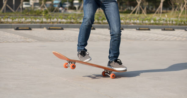 istock Skateboarder  skateboarding  on parking lot 1086857050