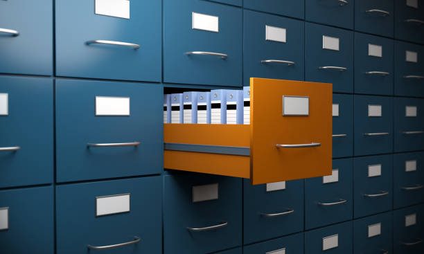 Different Filing Cabinet Orange colored filing cabinet between the blue ones. ( 3d render ) filing documents stock pictures, royalty-free photos & images