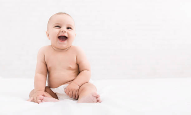 istock Cute baby sitting on white background, copy space 1086859234