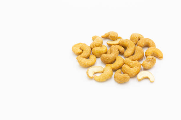 istock Roasted cashew nuts with salted isolated on white background 1086860258