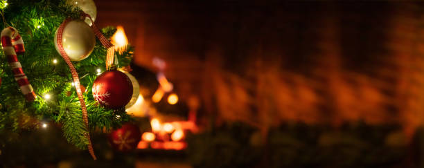 istock Christmas tree close up on blurred burning fireplace background 1086861740