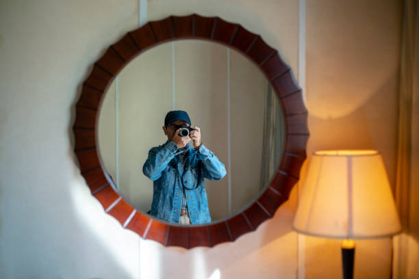 male self portrait in front of mirror