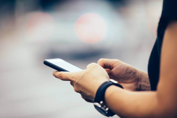 istock Hands use smartphone in modern city 1086862806