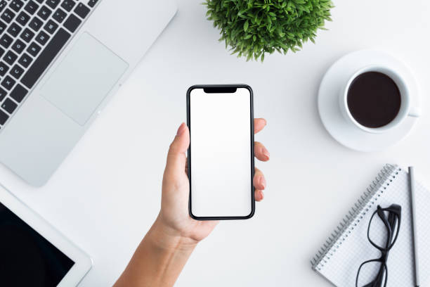 istock Hand holding smartphone with big blank screen 1086864078