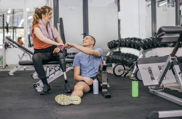 istock Disability couple fist bumps after training 1086866470