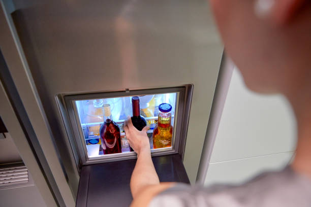 istock while the woman gets out of the fridge 1086870286