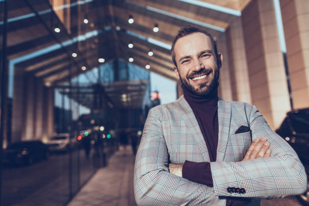 istock Happy man standing with his arms crosses and looking delighted 1086873070