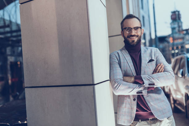 istock Cheerful man standing with his arms crossed and smiling 1086873208