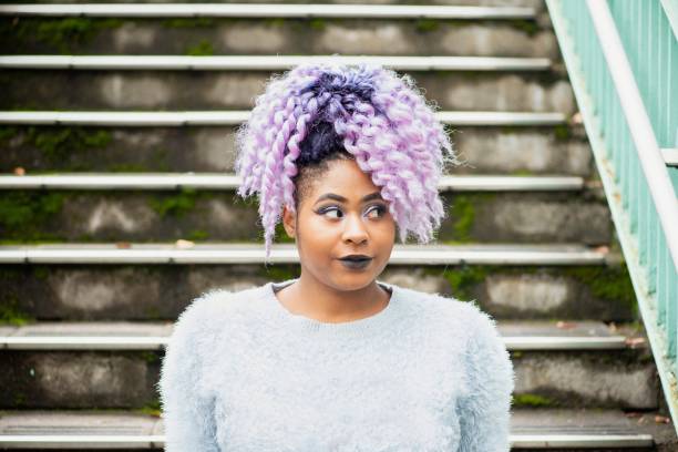 istock Young woman sitting outside 1086877814