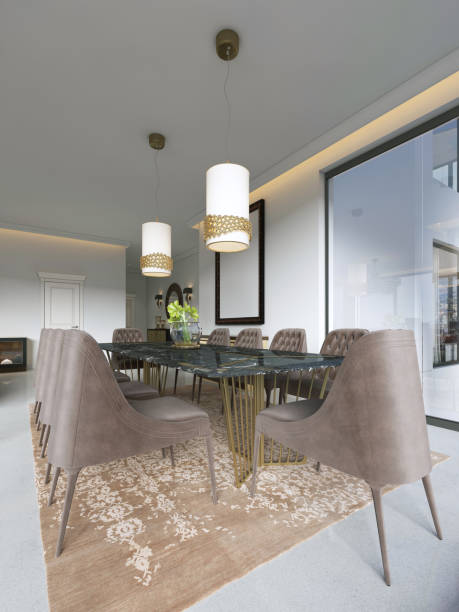 istock Dining room in classic and luxury style, with a rectangular wooden dining served table with decorative elements, ten upholstered chairs, two chandeliers. 1086877878