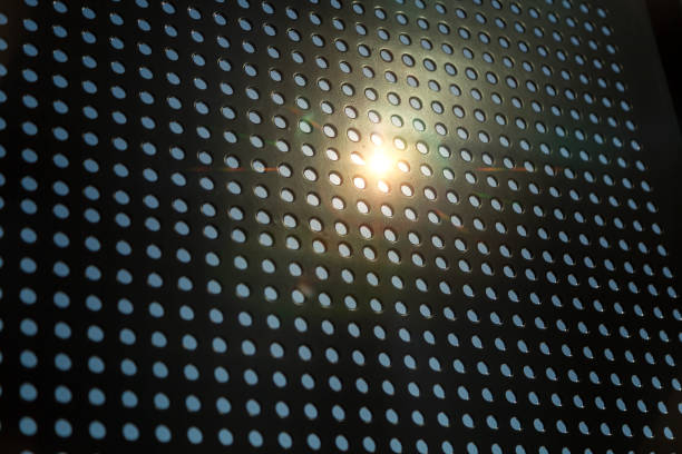 istock Metal plate and metal mesh texture in sunlight 1086878478
