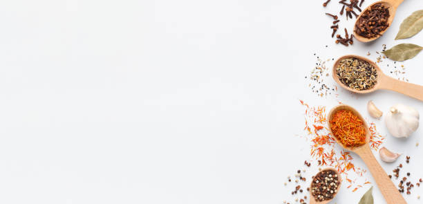 istock Various spices spoons and herbs on white background 1086879692