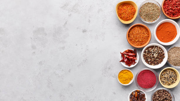 istock Traditional Indian spices in bowls on grey background 1086879724