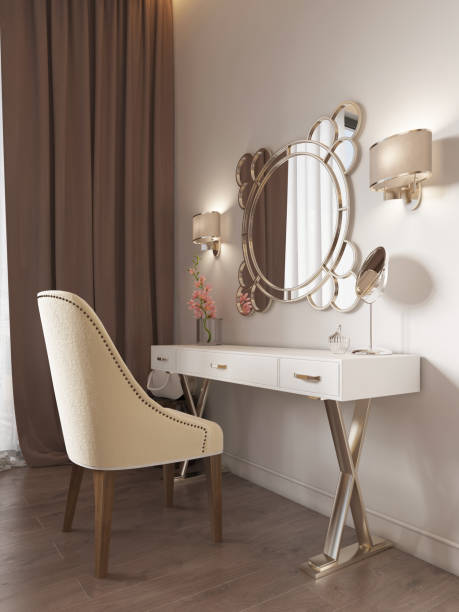 istock White dressing table with decor, mirror and sconces on the wall. White soft chair. 1086882448