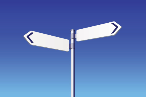 Blank Road Signs on blue sky background. Choose concept. 