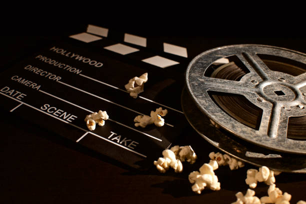 istock film reel and clapboard with popcorn 1086883878