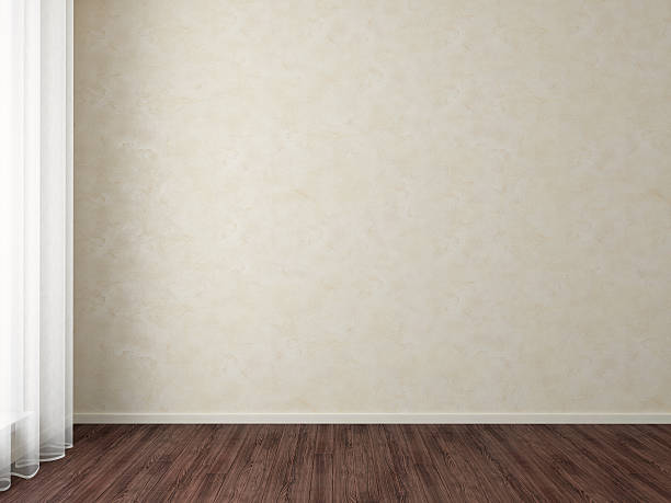 istock Empty room with dark wood floors and beige wallpaper 108688434