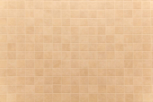 istock Full Frame Shot Of  Beige Tiled Wall 1086884698