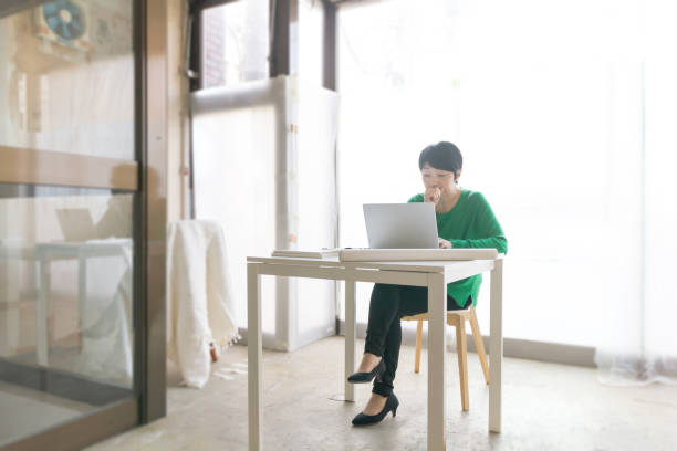 istock Asian businesswoman working on a laptop computer 1086887094