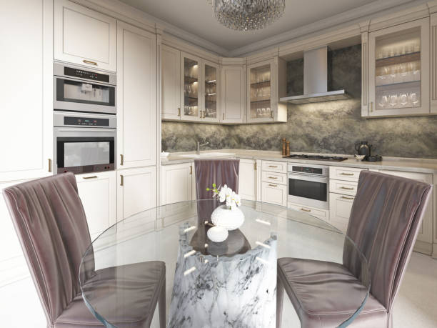 istock Contemporary kitchen with elements of a classic with a dining table glass chandelier. Interior in beige colors. 1086889574