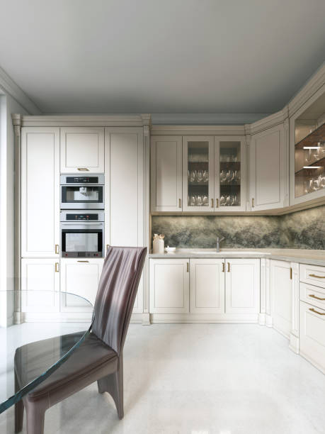 istock Modern art deco kitchen with classic elements. Glass facade and built-in appliances. Interior in beige colors. 1086890450
