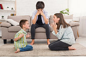 Mom is depressed by screaming children, siblings having quarrel