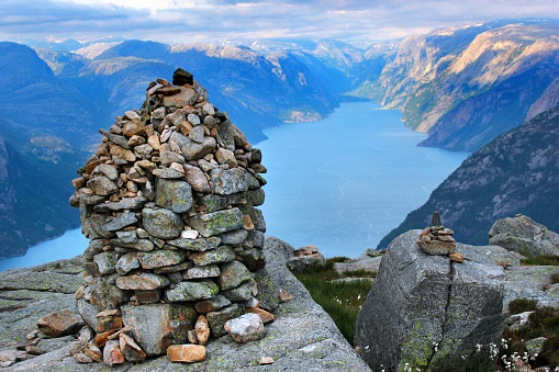 Stone cairn over Lysefjord and Preikestolen rock, Norway